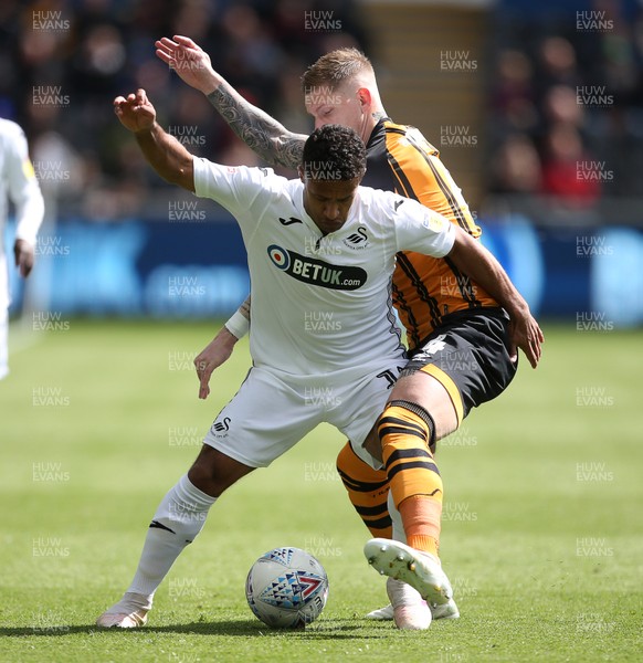 270419 - Swansea City v Hull City - SkyBet Championship - Wayne Routledge of Swansea City is tackled by Jordy de Wijs of Hull City