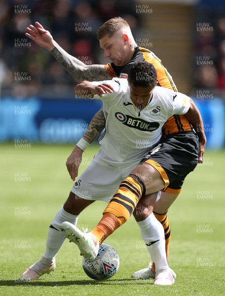 270419 - Swansea City v Hull City - SkyBet Championship - Wayne Routledge of Swansea City is tackled by Jordy de Wijs of Hull City