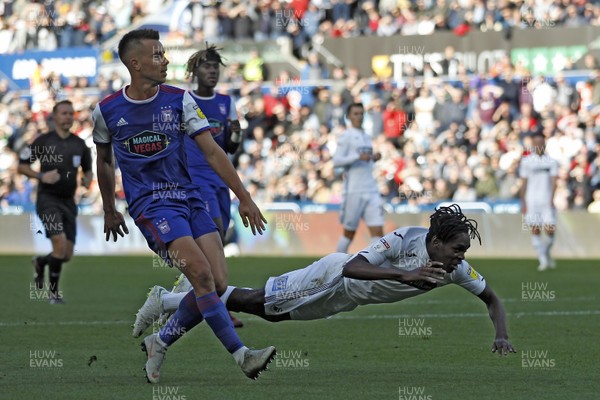 061018 - Swansea City v Ipswich Town, EFL Championship - Joel Asoro of Swansea City (right) goes down in the penalty area 
