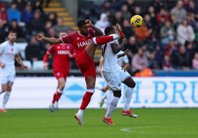 081125 - Swansea City v Ipswich Town, EFL Sky Bet Championship - Darnell Furlong of Ipswich wins the ball from Zeidane Inoussa of Swansea City