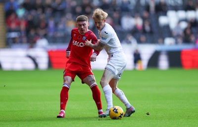 081125 - Swansea City v Ipswich Town, EFL Sky Bet Championship - Leif Davis of Ipswich and Melker Widell of Swansea City compete for the ball
