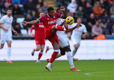 081125 - Swansea City v Ipswich Town, EFL Sky Bet Championship - Darnell Furlong of Ipswich wins the ball from Zeidane Inoussa of Swansea City
