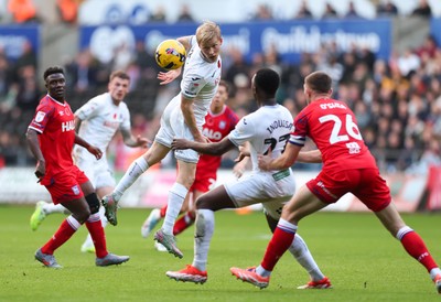 081125 - Swansea City v Ipswich Town, EFL Sky Bet Championship - Melker Widell of Swansea City heads the ball forward