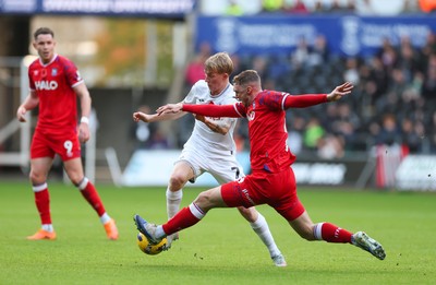 081125 - Swansea City v Ipswich Town, EFL Sky Bet Championship - Jack Taylor of Ipswich and Melker Widell of Swansea City compete for the ball
