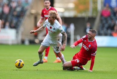 081125 - Swansea City v Ipswich Town, EFL Sky Bet Championship - Jack Taylor of Ipswich and Melker Widell of Swansea City compete for the ball