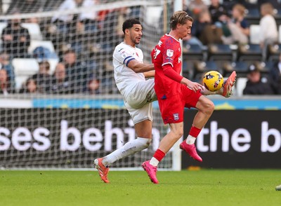 081125 - Swansea City v Ipswich Town, EFL Sky Bet Championship - Ben Cabango of Swansea City and Jack Clarke of Ipswich compete for the ball