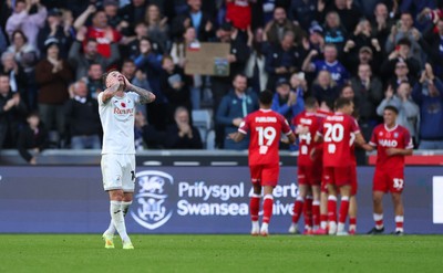 081125 - Swansea City v Ipswich Town, EFL Sky Bet Championship - Josh Tymon of Swansea City reacts as Ipswich celebrate their second goal with the fans