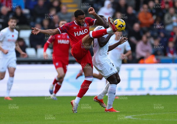 081125 - Swansea City v Ipswich Town, EFL Sky Bet Championship - Darnell Furlong of Ipswich wins the ball from Zeidane Inoussa of Swansea City