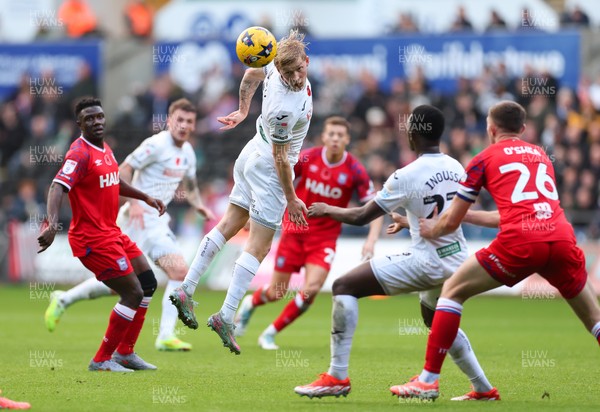 081125 - Swansea City v Ipswich Town, EFL Sky Bet Championship - Melker Widell of Swansea City heads the ball forward