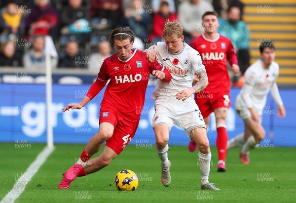 081125 - Swansea City v Ipswich Town, EFL Sky Bet Championship - Jack Clarke of Ipswich holds off Josh Key of Swansea City