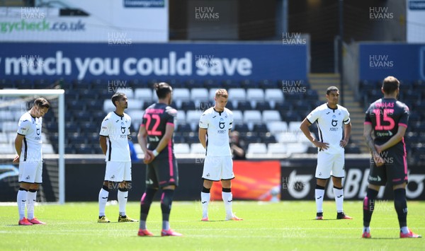 120720 - Swansea City v Leeds United - EFL SkyBet Championship - Players during a minutes silence in memory of Jack Charlton