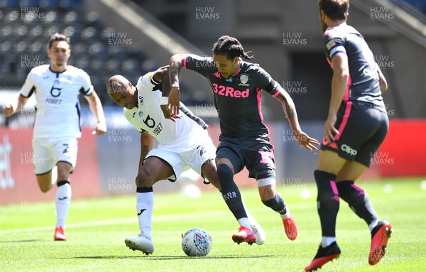 120720 - Swansea City v Leeds United - EFL SkyBet Championship - Andre Ayew of Swansea City is tackled by Helder Costa of Leeds United
