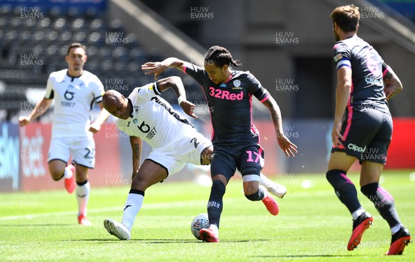120720 - Swansea City v Leeds United - EFL SkyBet Championship - Andre Ayew of Swansea City is tackled by Helder Costa of Leeds United
