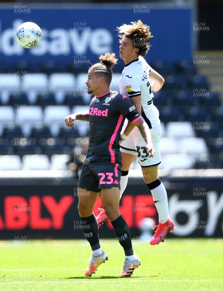 120720 - Swansea City v Leeds United - EFL SkyBet Championship - Kalvin Phillips of Leeds United and Conor Gallagher of Swansea City compete in the air