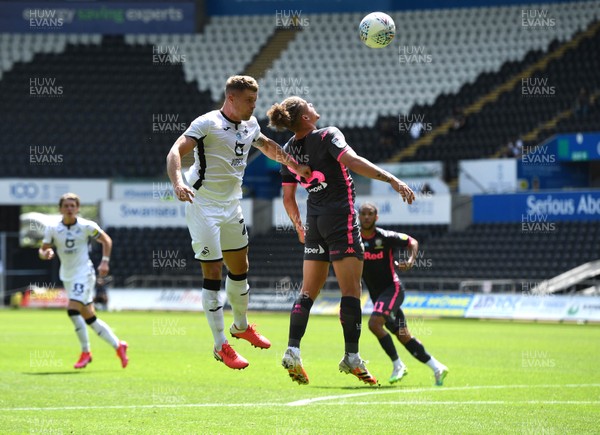 120720 - Swansea City v Leeds United - EFL SkyBet Championship - Erwin Mulder of Swansea City and Kalvin Phillips of Leeds United compete in the air