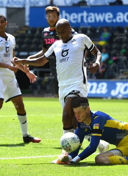120720 - Swansea City v Leeds United - EFL SkyBet Championship - Andre Ayew of Swansea City goes for the ball and Illan Meslier of Leeds United pounces