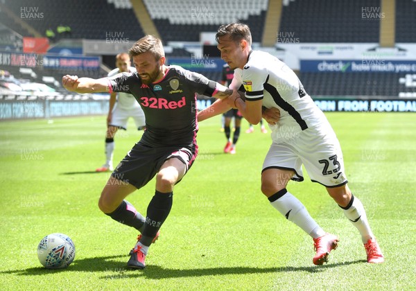 120720 - Swansea City v Leeds United - EFL SkyBet Championship - Stuart Dallas of Leeds United is tackled by Connor Roberts of Swansea City