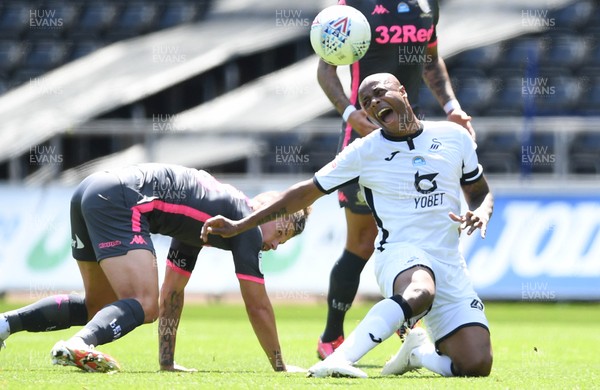 120720 - Swansea City v Leeds United - EFL SkyBet Championship - Andre Ayew of Swansea City is tackled by Kalvin Phillips of Leeds United