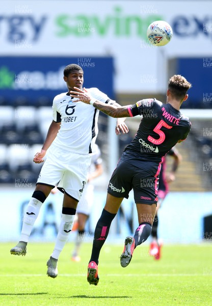 120720 - Swansea City v Leeds United - EFL SkyBet Championship - Rhian Brewster of Swansea City is tackled by Ben White of Leeds United