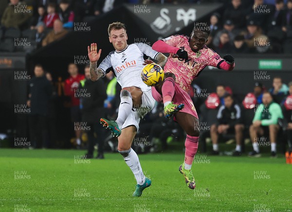 130224 - Swansea City v Leeds United, EFL Sky Bet Championship - Josh Tymon of Swansea City and Wilfried Gnonto of Leeds United compete for the ball