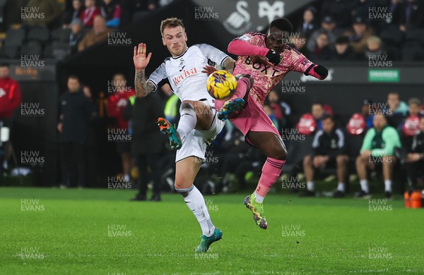 130224 - Swansea City v Leeds United, EFL Sky Bet Championship - Josh Tymon of Swansea City and Wilfried Gnonto of Leeds United compete for the ball