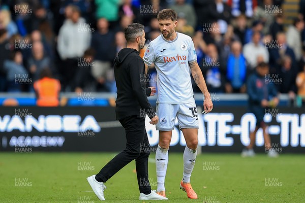 041025 - Swansea City v Leicester City - Sky Bet Championship - Cameron Burgess of Swansea City and Swansea City Manager Alan Sheehan 