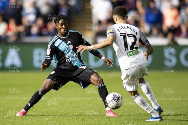 211023 - Swansea City v Leicester City - Sky Bet Championship - Abdul Fatawu of Leicester City in action against Jamie Paterson of Swansea City