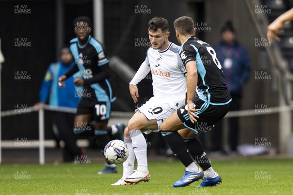 211023 - Swansea City v Leicester City - Sky Bet Championship - Liam Cullen of Swansea City in action against Harry Winks of Leicester City