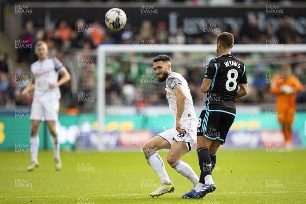 211023 - Swansea City v Leicester City - Sky Bet Championship - Harry Winks of Leicester City in action against Matt Grimes of Swansea City