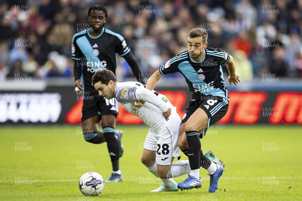 211023 - Swansea City v Leicester City - Sky Bet Championship - Harry Winks of Leicester City in action against Liam Walsh of Swansea City