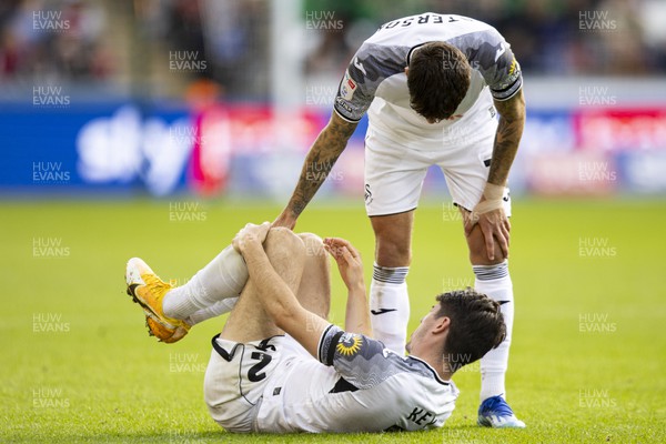 211023 - Swansea City v Leicester City - Sky Bet Championship - Josh Key of Swansea City goes down injured