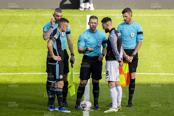 211023 - Swansea City v Leicester City - Sky Bet Championship - Match Referee Anthony Backhouse with Jamie Vardy of Leicester City & Matt Grimes of Swansea City ahead of kick off