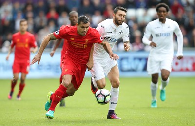 011016 - Swansea City v Liverpool, Premier League - Borja Gonzalez of Swansea City and Dejan Lovren of Liverpool compete for the ball