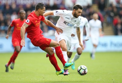 011016 - Swansea City v Liverpool, Premier League - Borja Gonzalez of Swansea City and Dejan Lovren of Liverpool compete for the ball