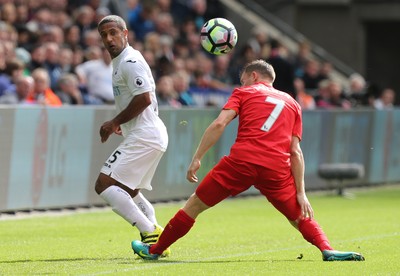 011016 - Swansea City v Liverpool, Premier League - Wayne Routledge of Swansea City flicks the ball past James Milner of Liverpool