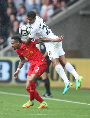 011016 - Swansea City v Liverpool, Premier League - Kyle Naughton of Swansea City gets above Nathaniel Clyne of Liverpool to win the ball