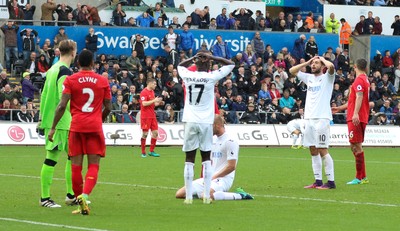 011016 - Swansea City v Liverpool, Premier League - Modou Barrow of Swansea City and Borja Gonzalez of Swansea City react after Mike van der Hoorn of Swansea City misses a chance to level the score