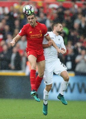 011016 - Swansea City v Liverpool, Premier League - Jordan Henderson of Liverpool wins the ball from Gylfi Sigurdsson of Swansea City