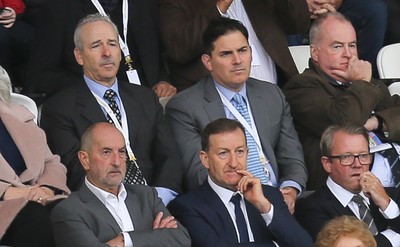 011016 - Swansea City v Liverpool, Premier League - Swansea City's American owners Stephen Kaplan, back left, and Jason Levien, on his left, watch the match sat behind Chairman Huw Jenkins, front centre