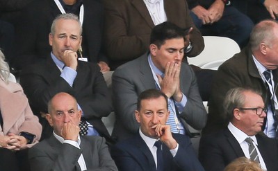 011016 - Swansea City v Liverpool, Premier League - Swansea City's American owners Stephen Kaplan, back left, and Jason Levien, on his left, watch the match sat behind Chairman Huw Jenkins, front centre