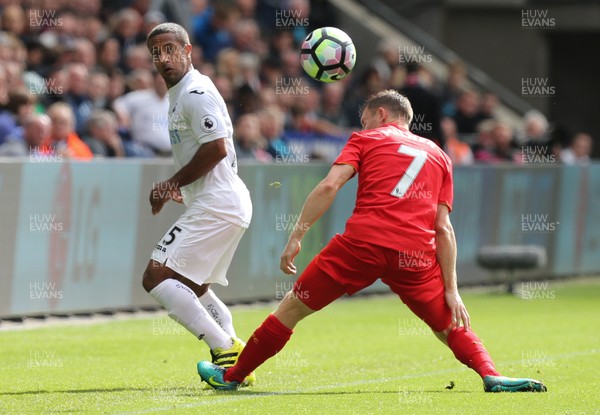 011016 - Swansea City v Liverpool, Premier League - Wayne Routledge of Swansea City flicks the ball past James Milner of Liverpool