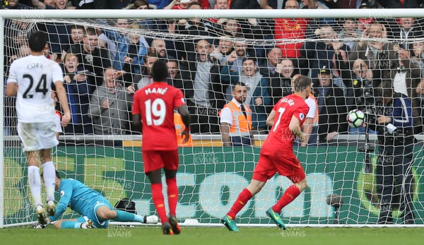 011016 - Swansea City v Liverpool, Premier League - James Milner of Liverpool beats Swansea City goalkeeper Lukasz Fabianski from the penalty spot to score the second goal