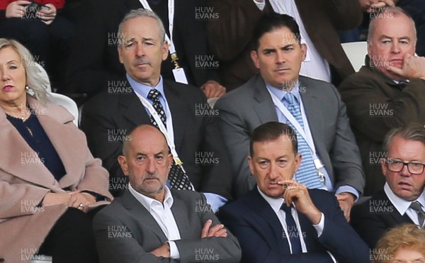 011016 - Swansea City v Liverpool, Premier League - Swansea City's American owners Stephen Kaplan, back left, and Jason Levien, on his left, watch the match sat behind Chairman Huw Jenkins, front centre