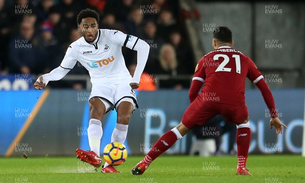 220118 - Swansea City v Liverpool - Premier League - Leroy Fer of Swansea City is challenged by Alex Oxlade-Chamberlain of Liverpool