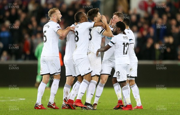 220118 - Swansea City v Liverpool - Premier League - Alfie Mawson of Swansea City celebrates scoring a goal with team mates