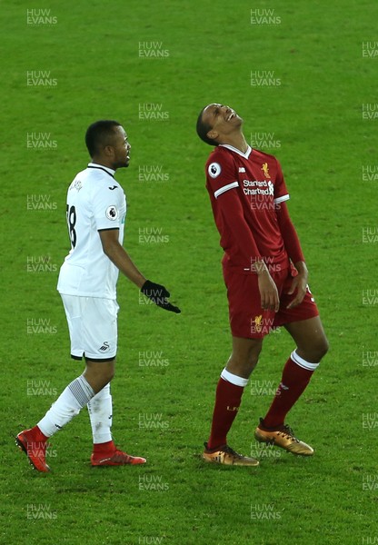 220118 - Swansea City v Liverpool - Premier League - A frustrated Joel Matip of Liverpool and Jordan Ayew of Swansea City