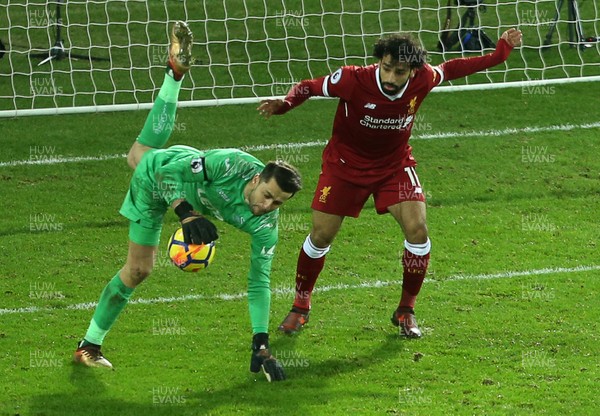 220118 - Swansea City v Liverpool - Premier League - lukasz Fabianski of Swansea City collides with Mohamed Salah of Liverpool