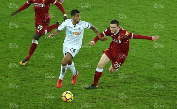 220118 - Swansea City v Liverpool - Premier League - Kyle Naughton of Swansea City is challenged by Andrew Robertson of Liverpool