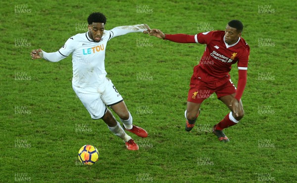 220118 - Swansea City v Liverpool - Premier League - Leroy Fer of Swansea City is challenged by Georginio Wijnaldum of Liverpool