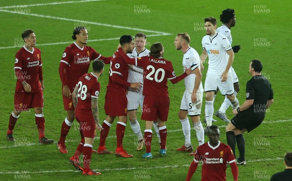 220118 - Swansea City v Liverpool - Premier League - Tensions boil over between Emre Can of Liverpool and Mike van der Hoorn of Swansea City at full time
